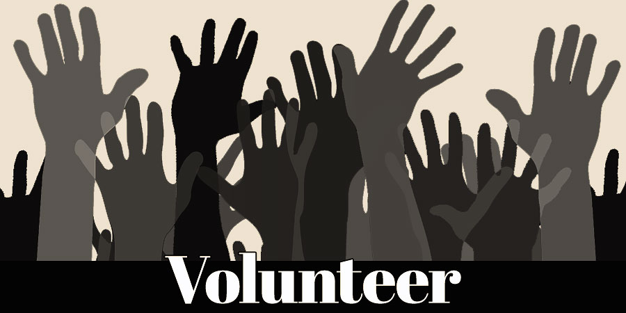 silhouette of hands raised to volunteer